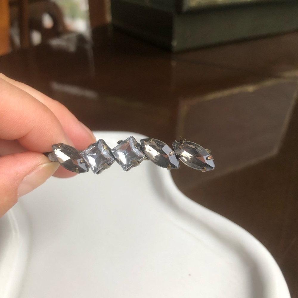 Three finger crystal ring.